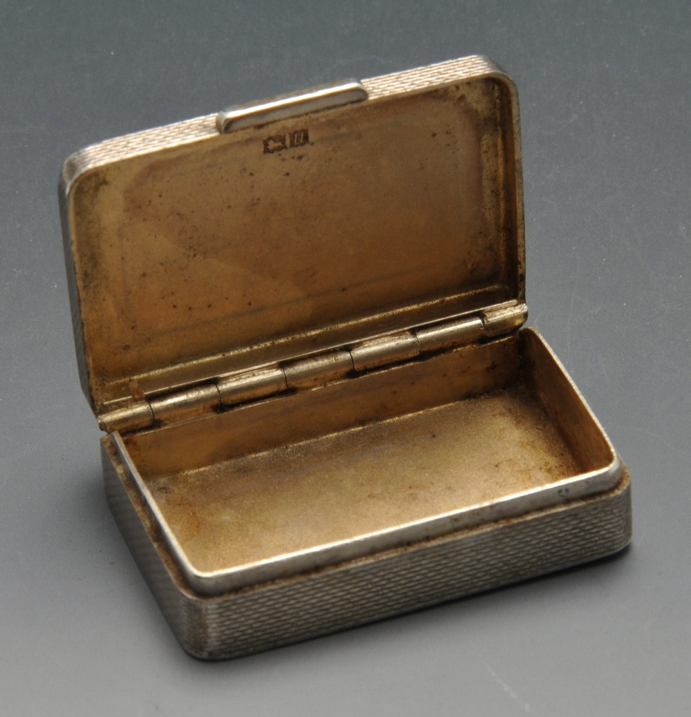 A 1960's silver small snuff or pill box, of plain rectangular form having engine-turned exterior - Image 2 of 6