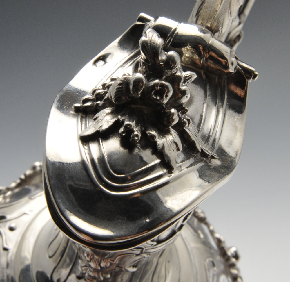 A French silver mounted claret jug, the segmented body overlaid with floral swags rising to the - Image 5 of 7