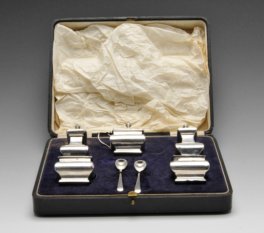 A 1920's cased silver condiment set comprising a pair of pepper pots and a pair of open salts and