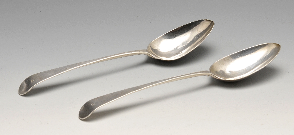 A pair of George III Old English pattern silver table spoons with initialled terminal and extended