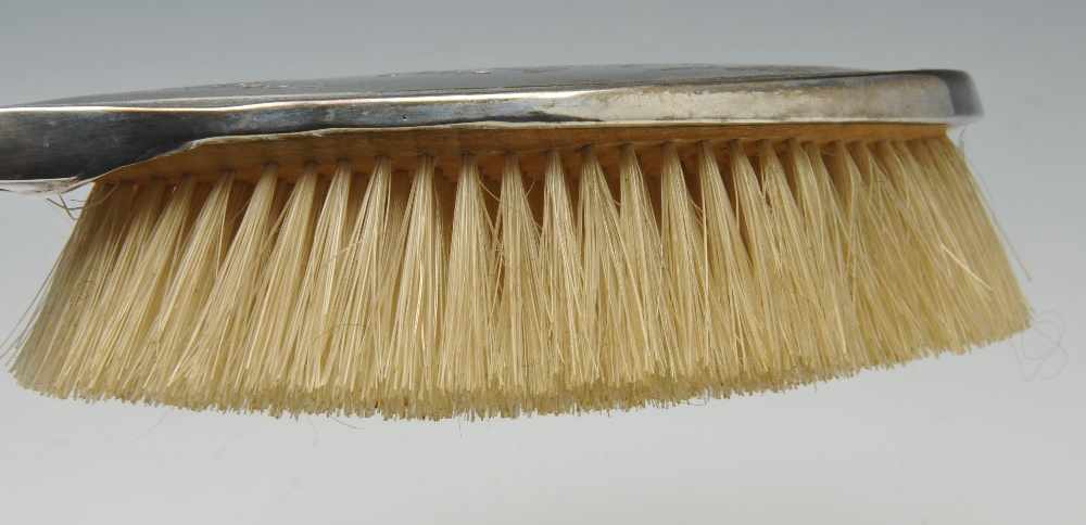 An early twentieth century silver mounted dressing table set, comprising a hand mirror, a pair of - Image 8 of 10