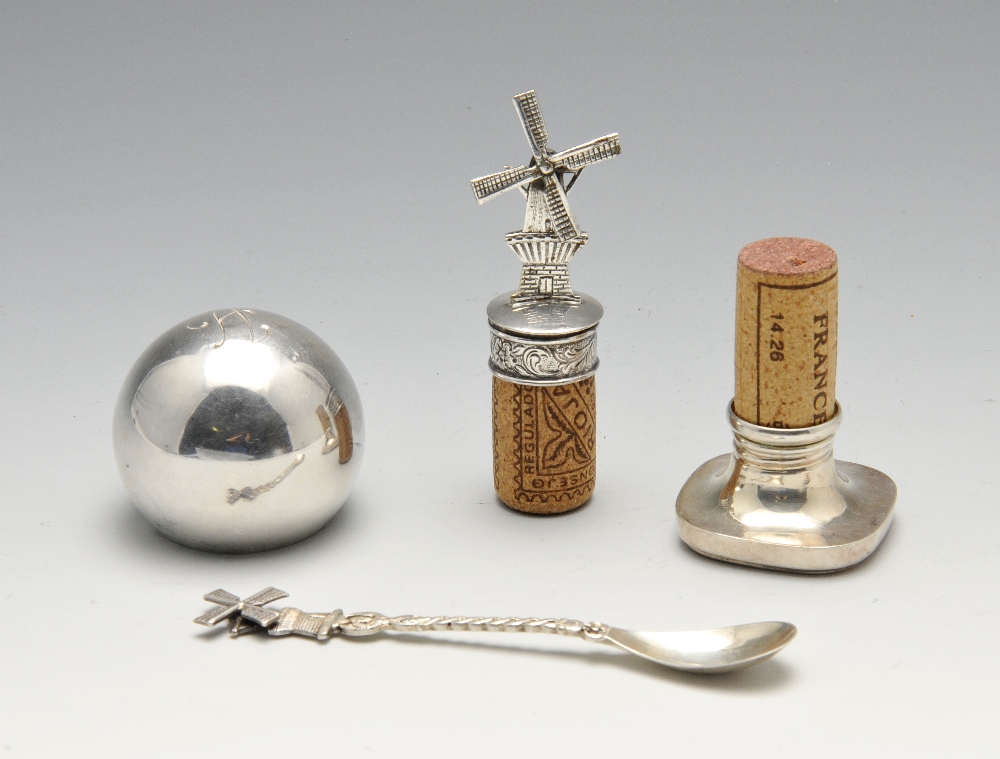 Three various Continental bottle stops, comprising a German example of spherical form having