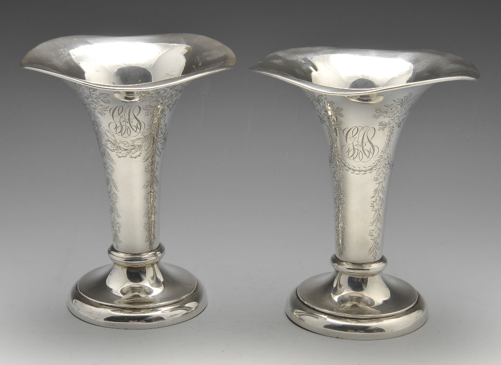 A pair of Tiffany & Co. silver vases, the tapering bodies with floral garland engraving and monogram