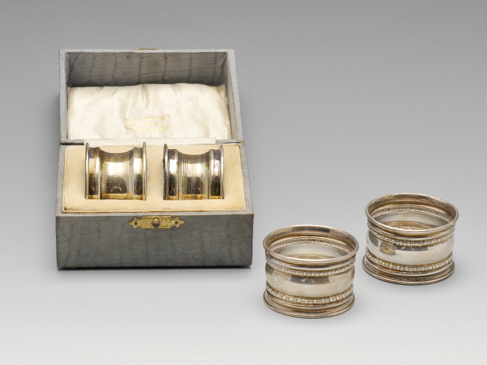 A pair of George V silver napkin rings having beaded banding, hallmarked Gorham Manufacturing Co.,