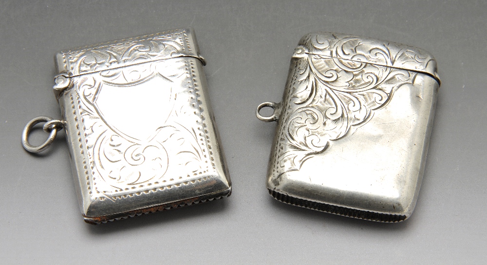 An Edwardian and early twentieth century silver vesta cases, hallmarked Birmingham 1904 and 1911.