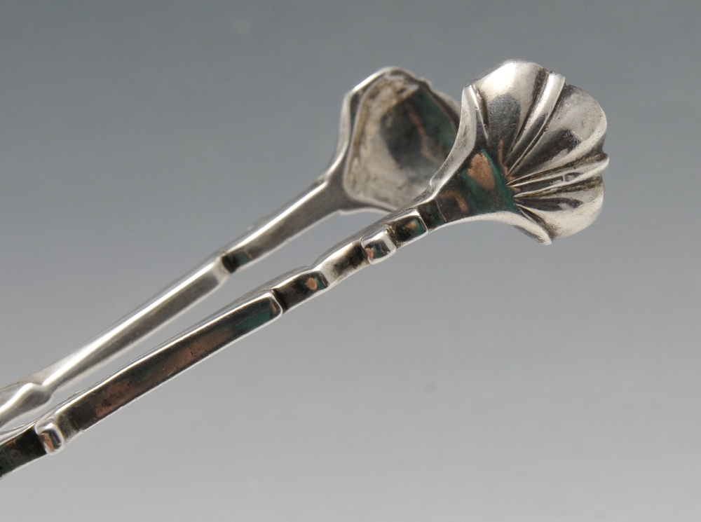 Two similar Georgian silver scissor action sugar tongs, with scroll arms and shell bowls. Part - Image 6 of 6