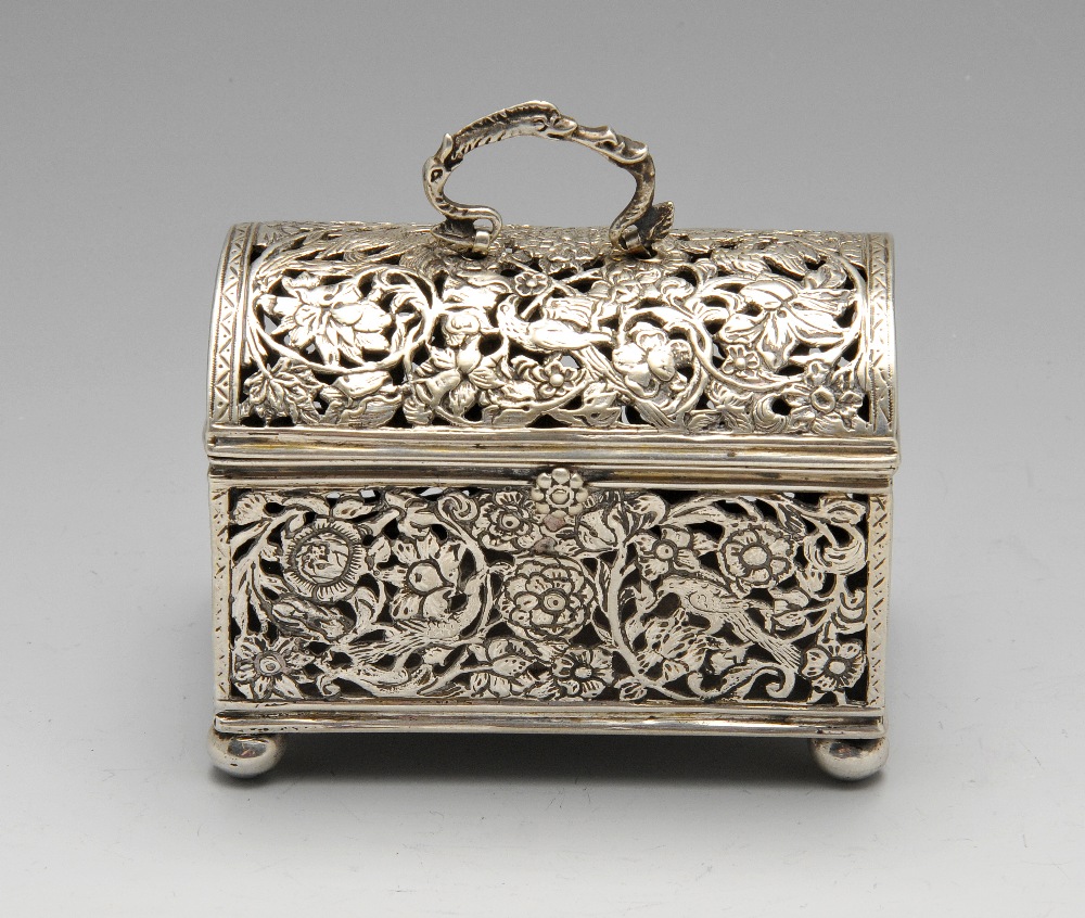 A continental box of casket form, the oblong open-work form depicting birds amidst floral scrolls,