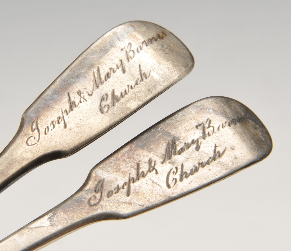 A pair of George III silver sugar tongs of scroll form, crested and with shell bowls, together - Image 3 of 8