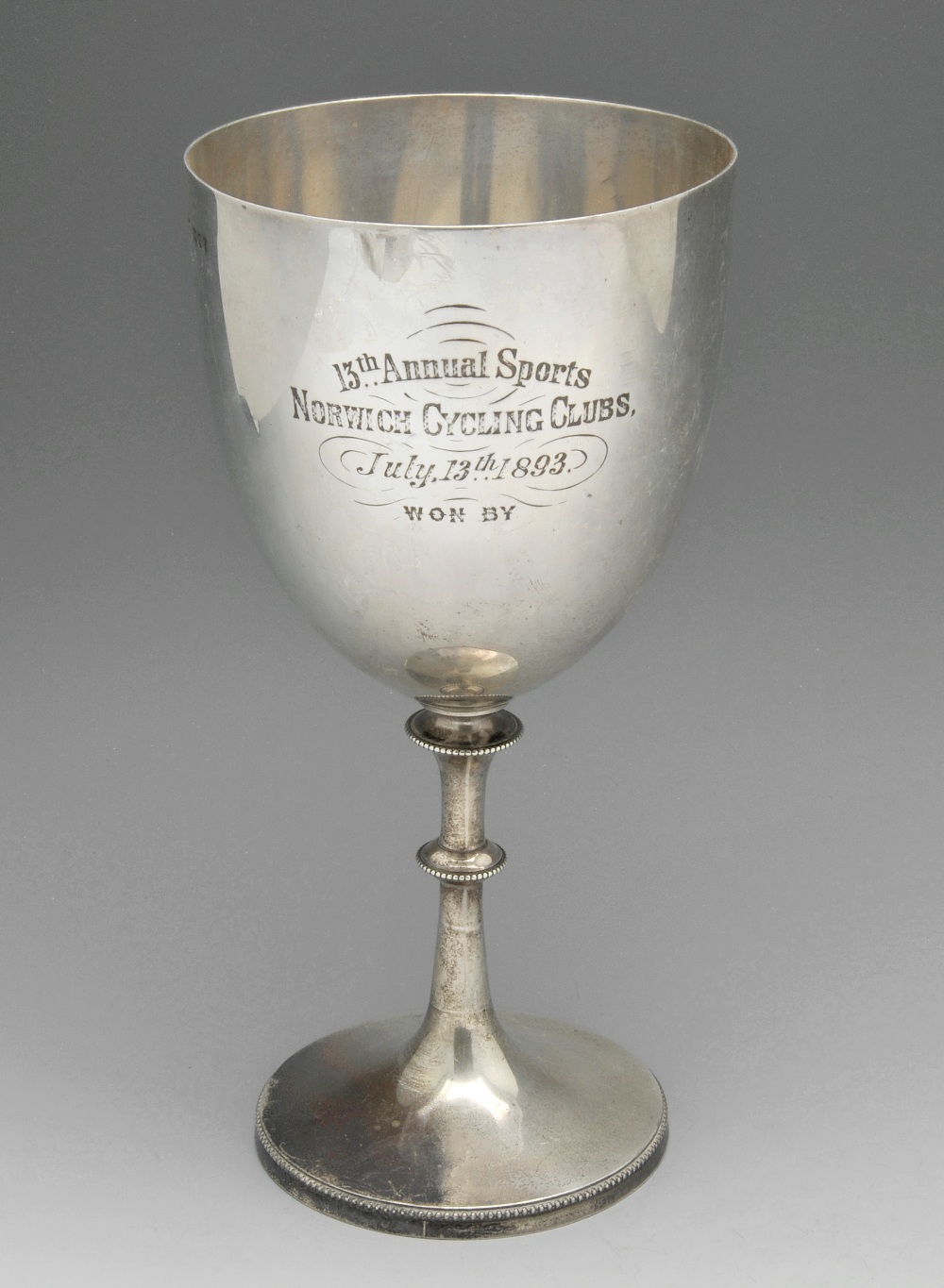 A Victorian silver trophy goblet for Norwich Cycling Club, of typical form and having beaded rim