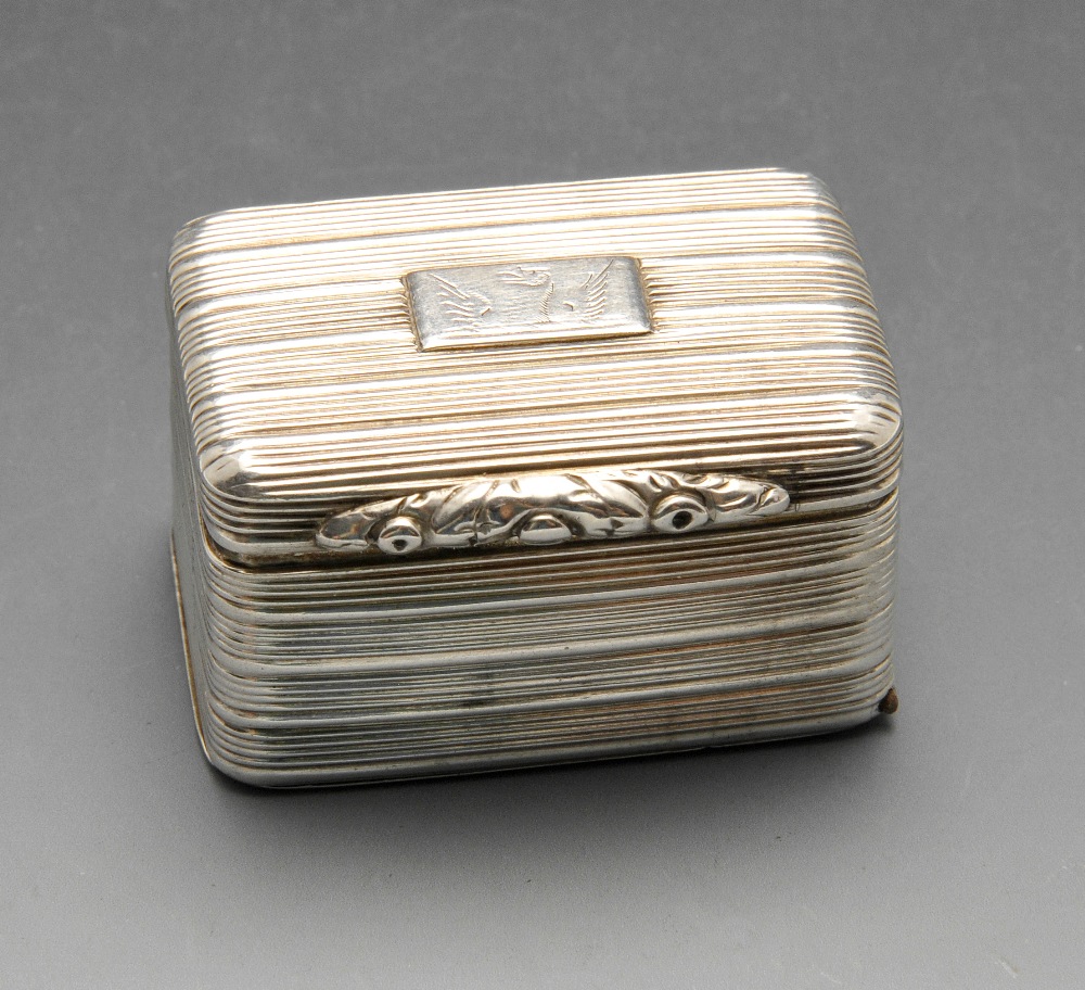 A George IV silver nutmeg grater, the oblong reeded form with dual hinges, crested cartouche and