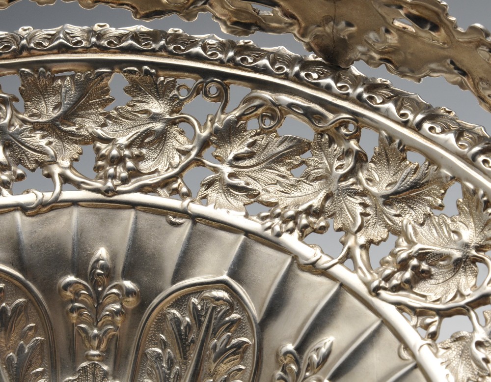 A George IV silver swing handle basket, the circular form fluted and rising to an openwork vine - Image 3 of 6