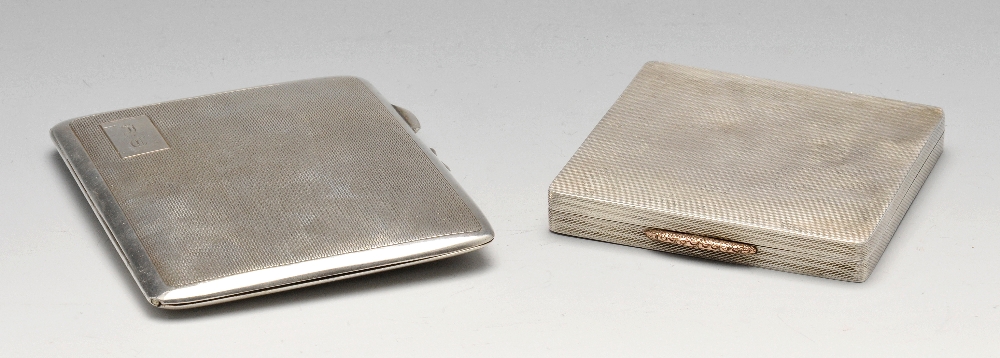 An 1930's silver cigarette case, of bulging rectangular form having engine turned panel exterior