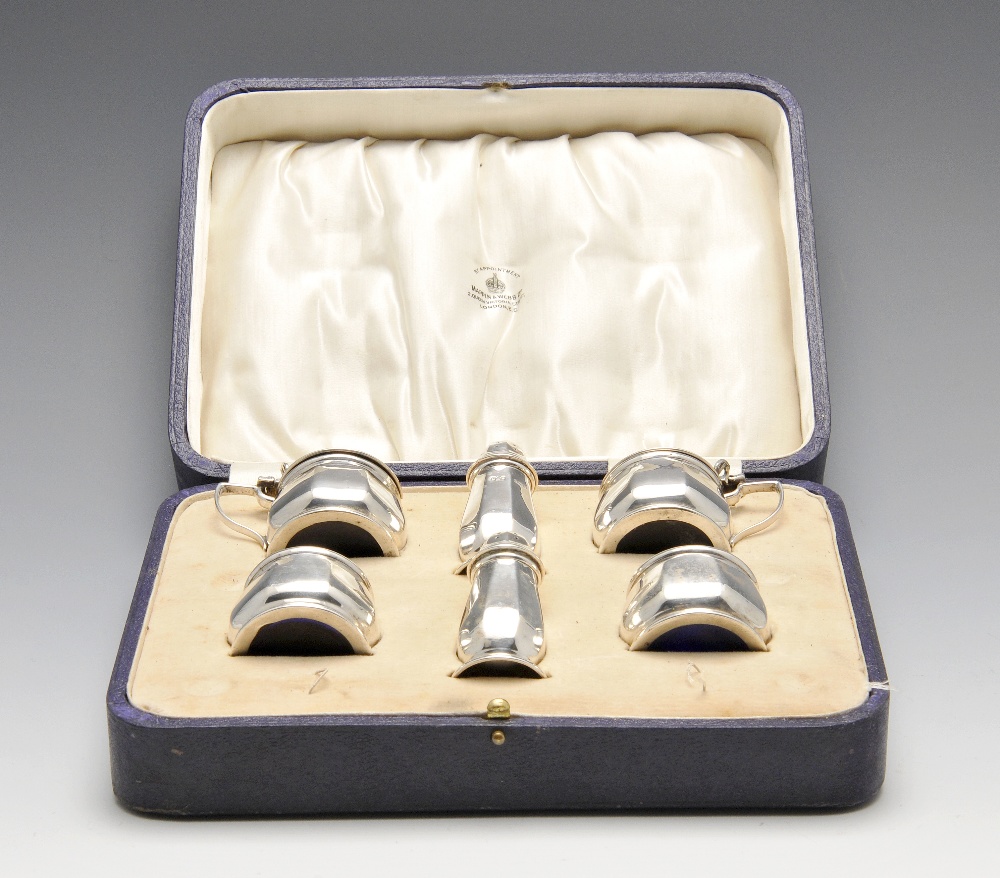 A 1920's cased silver part condiment set comprising a pair of pepper pots, a pair of open salts