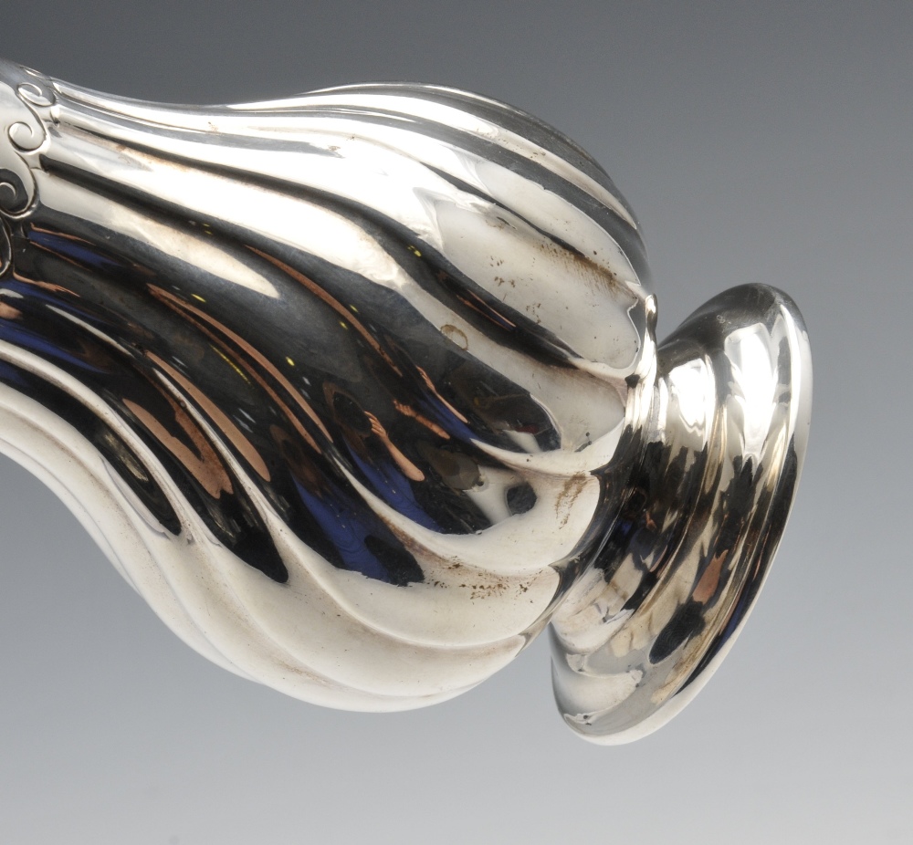 A late Victorian silver caster, of fluted pear form having pierced cover and flame finial, raised - Image 5 of 5