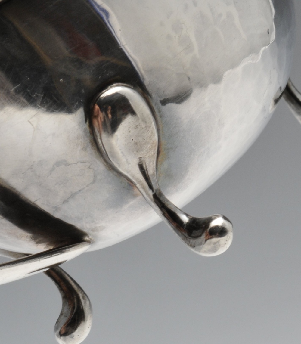 An Italian silver sauce boat of planished form with moulded rim, split loop handle and raised on - Image 4 of 5