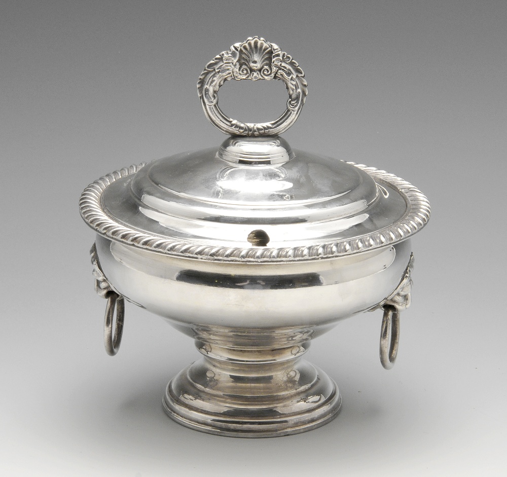 A silver plated pedestal soup tureen and cover of plain circular form with gadrooned rim and lion