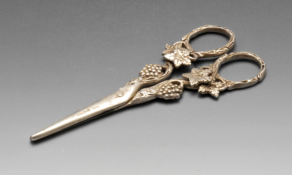 A 1920's pair of silver import grape scissors, with fruiting body and vine handles. Hallmarked