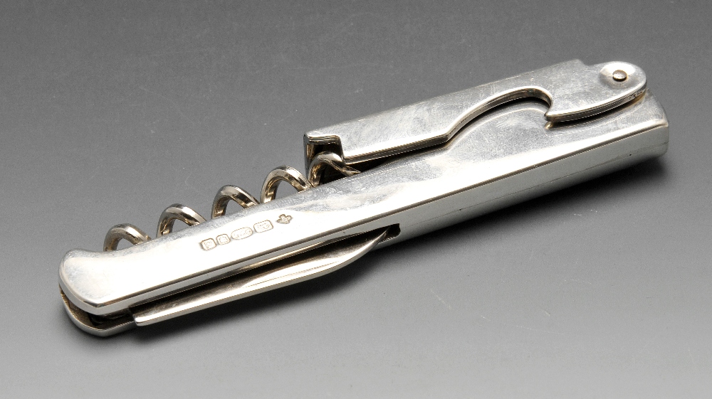 A modern silver mounted corkscrew and bottle opener. Hallmarked Marlow Brothers, London 2003. Length