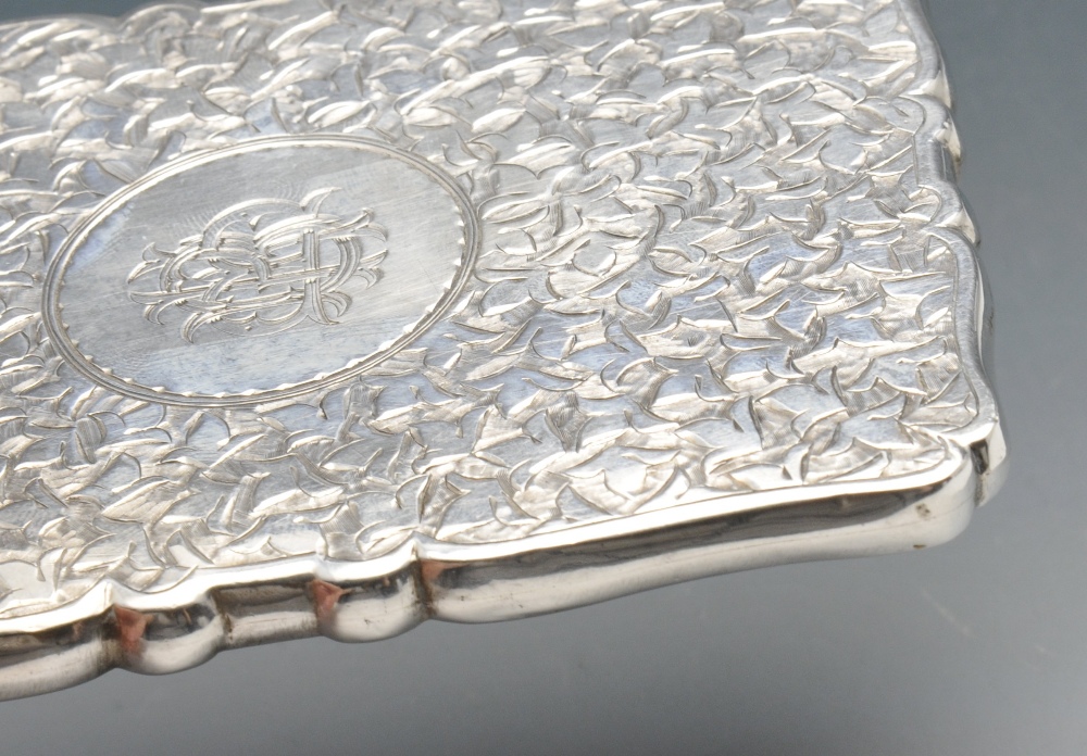 A late Victorian silver card case, the oblong form with scalloped edge entirely decorated with - Image 3 of 4