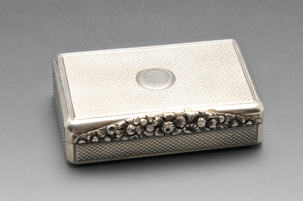 A George IV silver snuff box, the oblong form with engine-turned decoration, crested circular