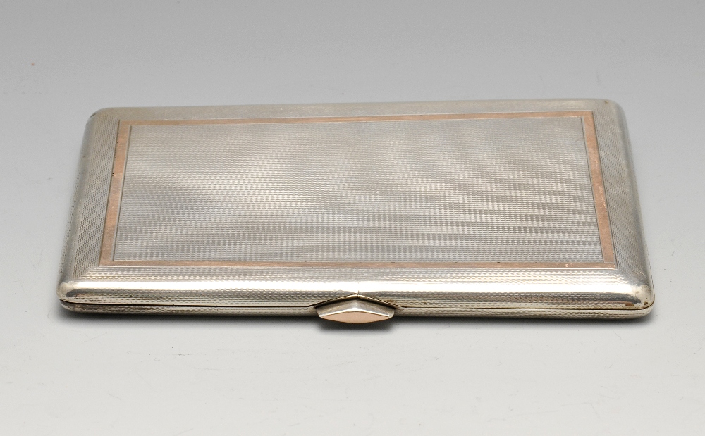 A 1930's silver cigarette case of oblong form with engine-turned decoration, gold tone border and