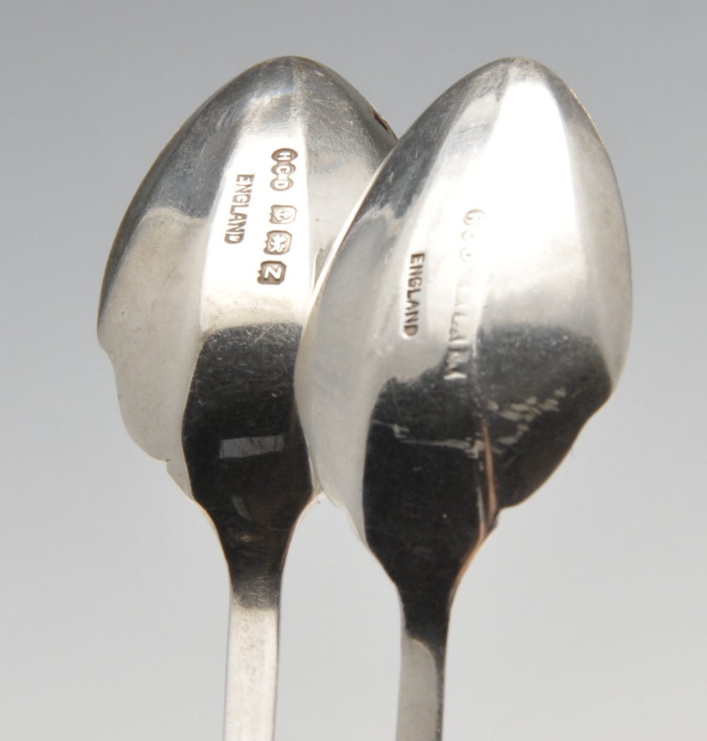 A cased set of Art Deco enamelled coffee spoons, the faceted bowls with shaped shoulders rising to - Image 3 of 4