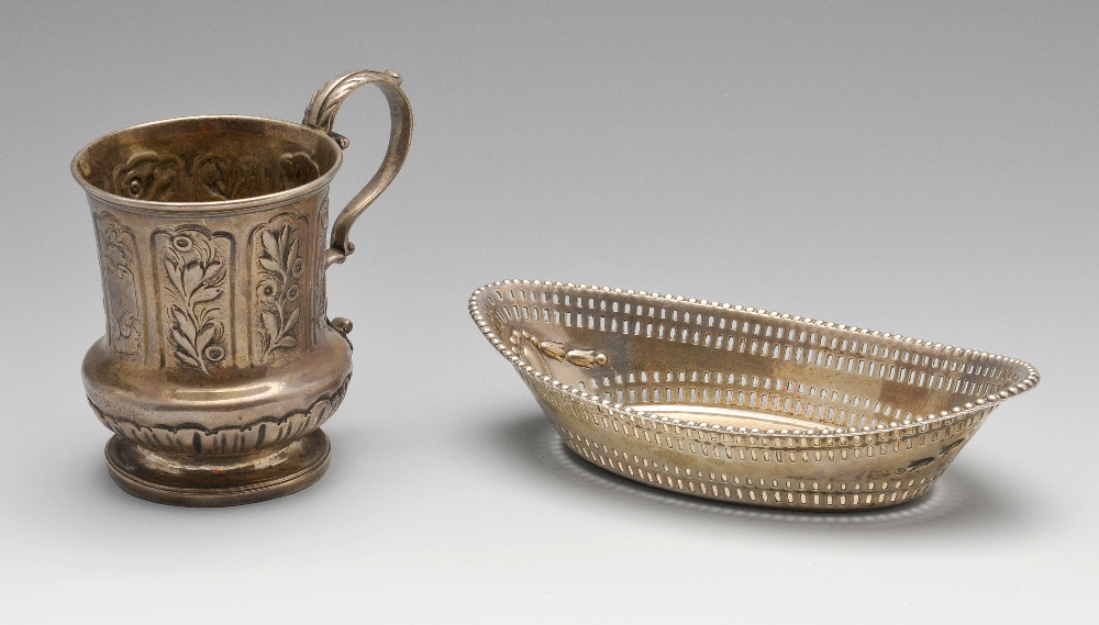 A George IV silver christening mug decorated with embossed floral and foliate panels and having a