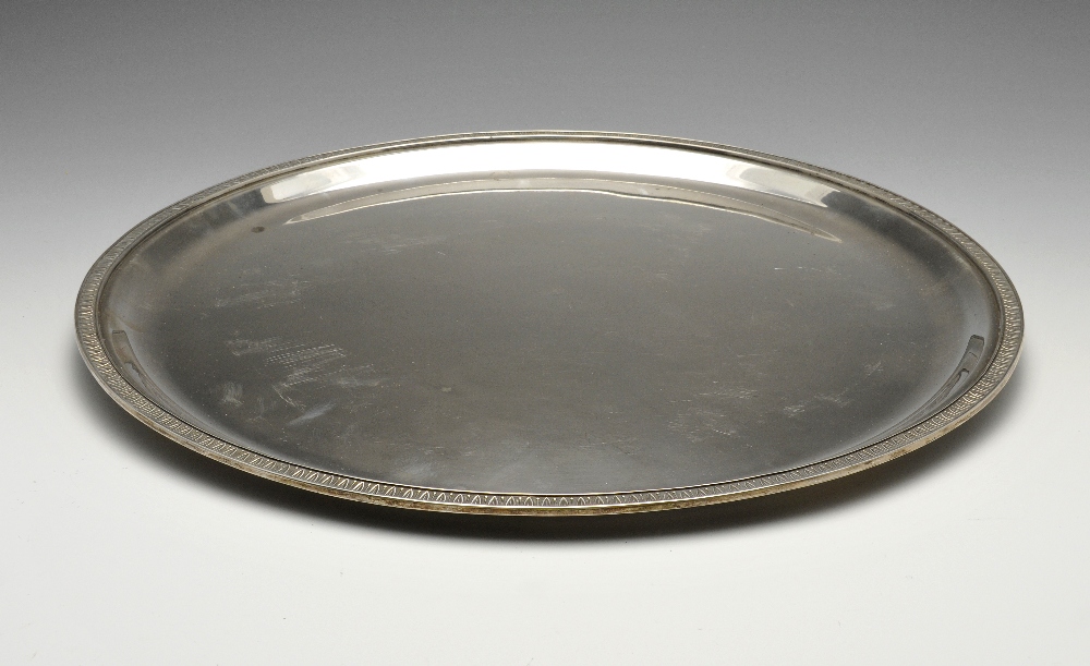 A large Italian silver tray, of plain circular form having formal leaf border to rim. Marked 800