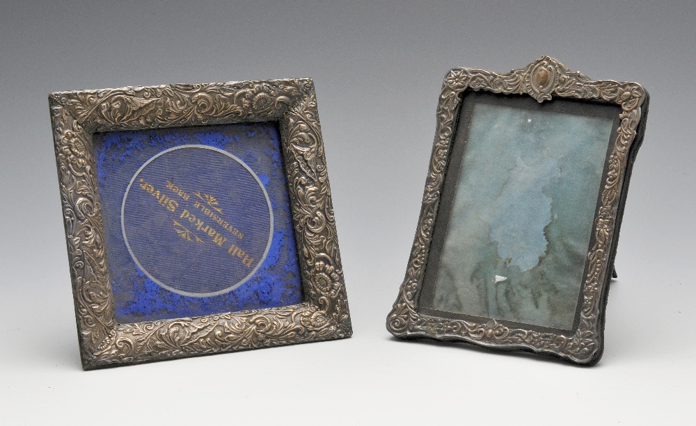 A late Victorian silver mounted photograph frame with easel back, the shaped rectangular form with