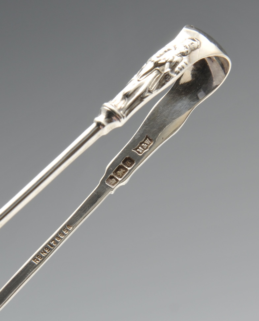 A cased set of six late Victorian silver spoons and sugar tongs having apostle terminals and foliate - Image 5 of 7