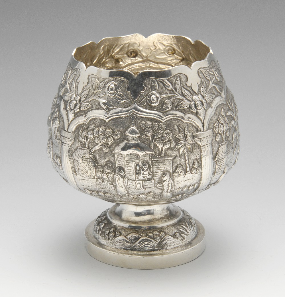An Indian style bowl of squat goblet form, ornately decorated throughout with various figurative and