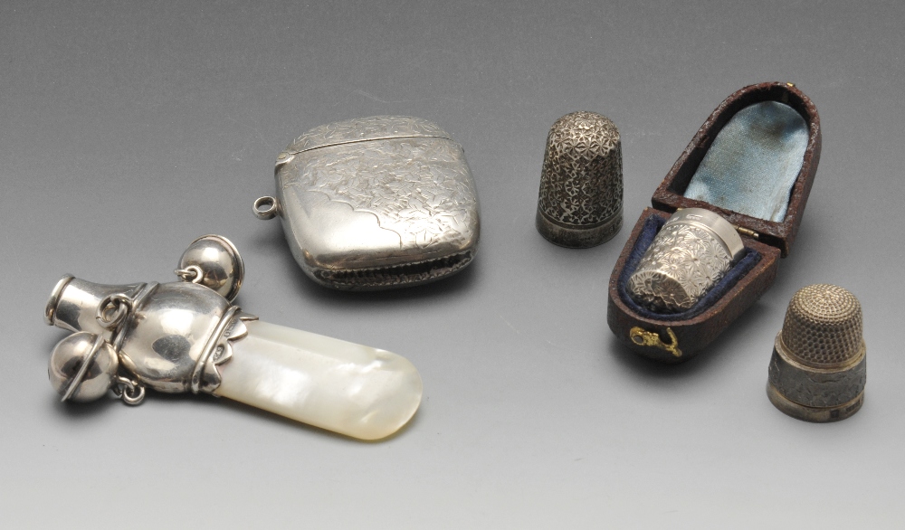 A selection of Edwardian and later silver items to include a foliate engraved vesta case with vacant