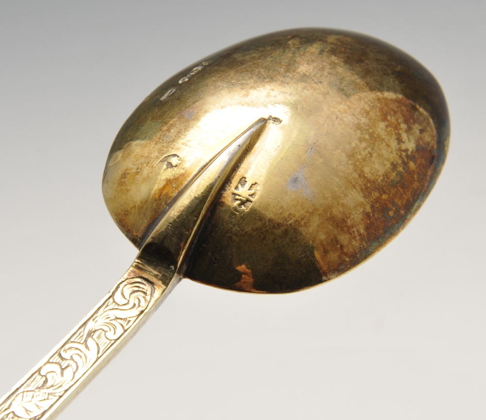 An Edwardian imported replica silver-gilt Trefid spoon with foliate engraved stem with stylised - Image 6 of 8