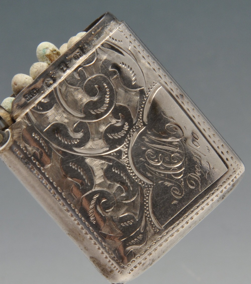 A late Victorian silver vesta case, engraved throughout with leaf patterns surrounding a vacant - Image 3 of 5