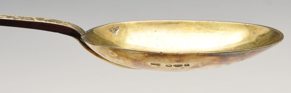 An Edwardian imported replica silver-gilt Trefid spoon with foliate engraved stem with stylised - Image 7 of 8