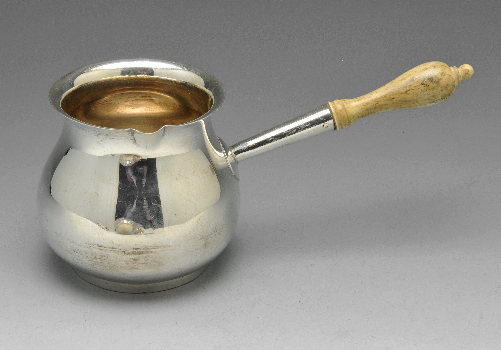 A Portuguese silver brandy saucepan of typical form, with Porto Assay marks for .833 standard,