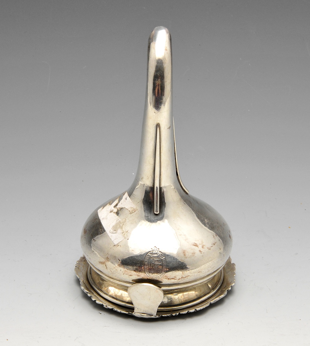 A George III provincial silver wine funnel, the bulbous body crested and with detachable sieve and