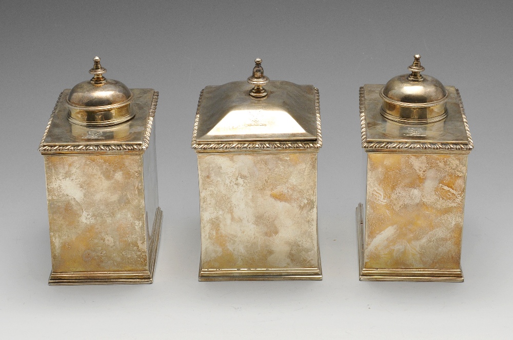 A set of three George III silver caddies, comprising a pair of tea caddies and a sugar box, each