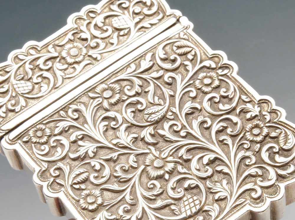 A continental card case, the deep oblong form with scalloped edge and chased with floral scroll - Image 4 of 4