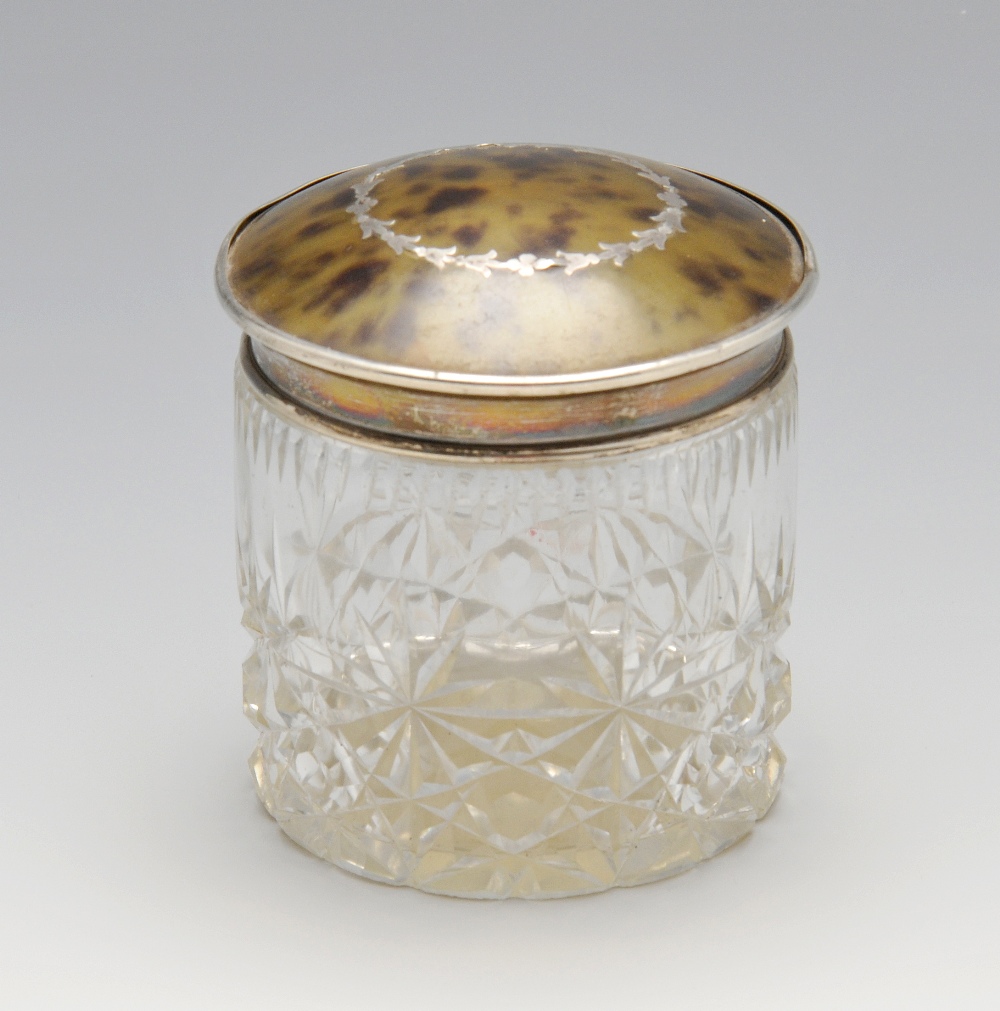 A 1920's silver and tortoiseshell lidded cut glass vanity jar. Hallmarked Herbert Scott Murdoch,