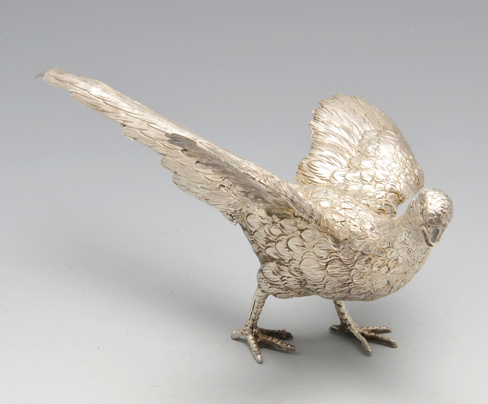 A modern silver table ornament realistically modelled as a pheasant. Hallmarked C S R Ltd, London