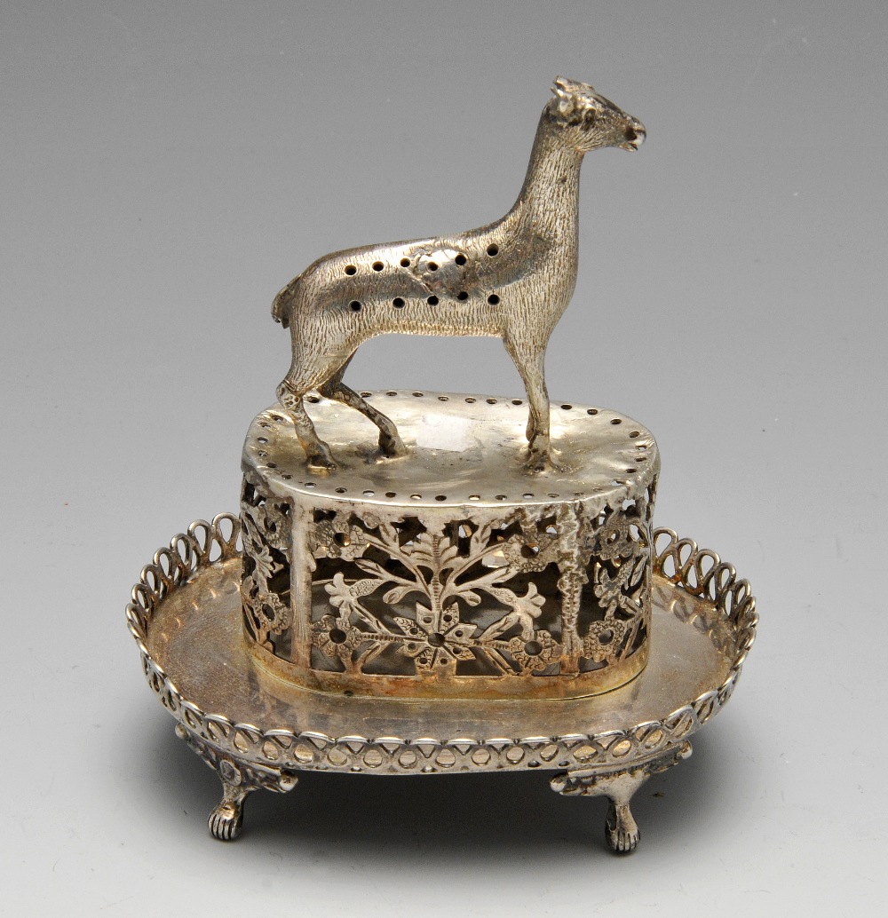 A continental toothpick holder, probably Portuguese, of oval form rising to a florally pierced