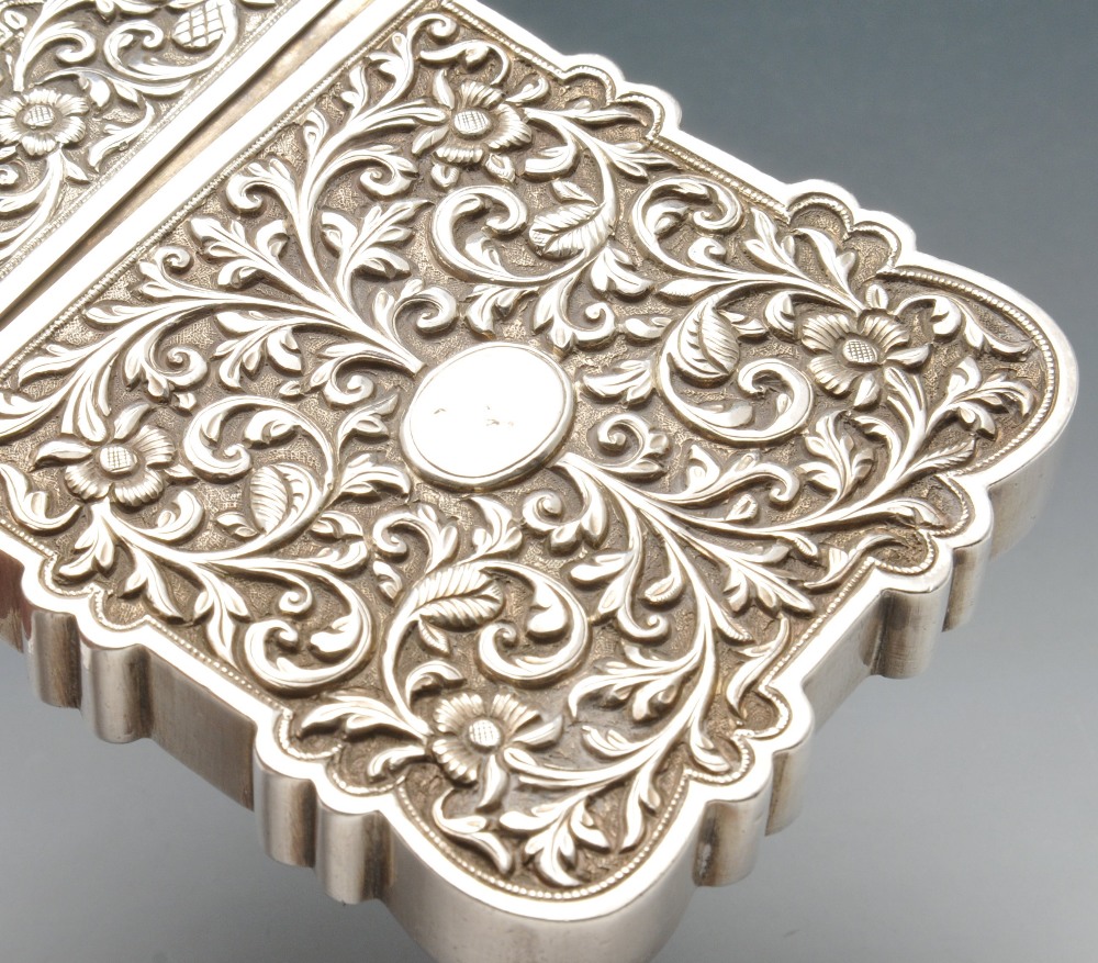 A continental card case, the deep oblong form with scalloped edge and chased with floral scroll - Image 2 of 4