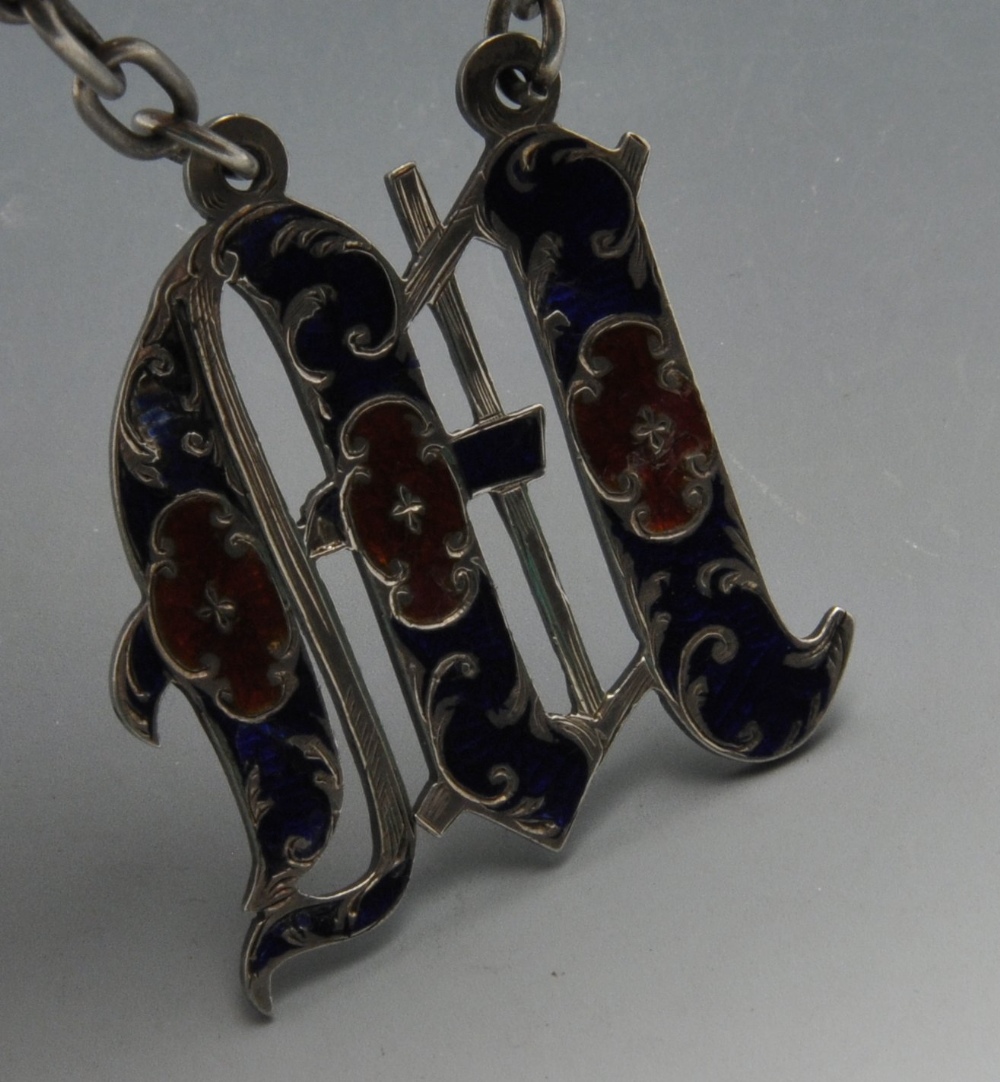 An early Victorian silver wine label, the letter 'M' enamelled in red and blue on wide suspension - Image 2 of 3