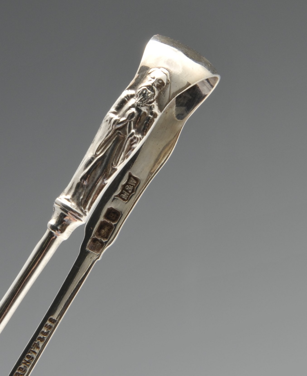 A cased set of six late Victorian silver spoons and sugar tongs having apostle terminals and foliate - Image 6 of 7