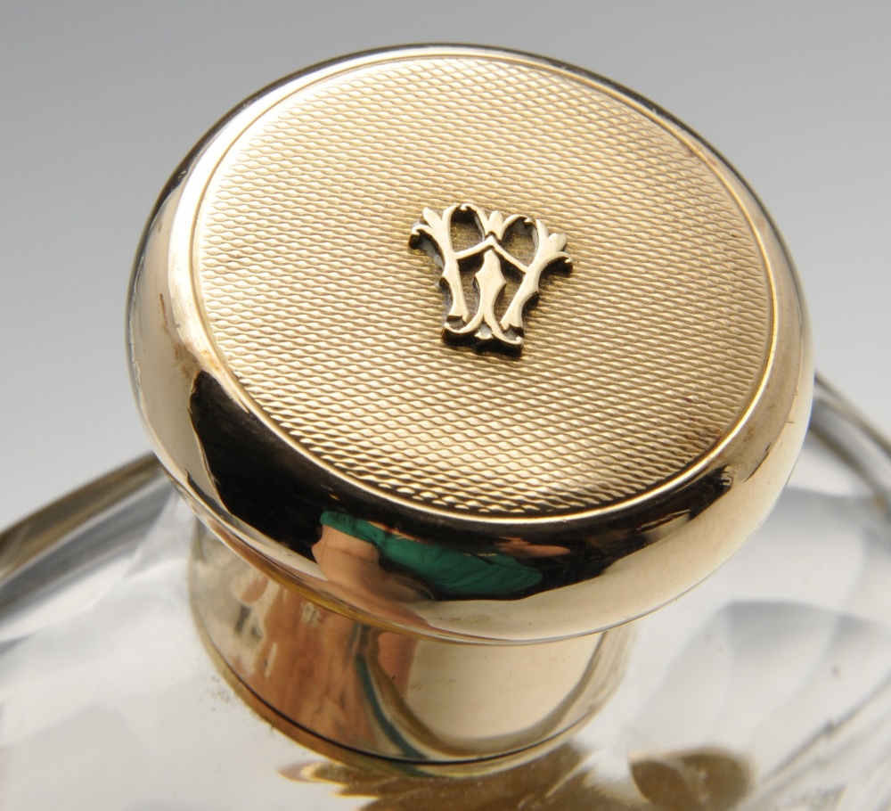 A 1920's 9ct gold mounted hip flask, the glass body with faceted shoulders, detachable cup and - Image 2 of 4