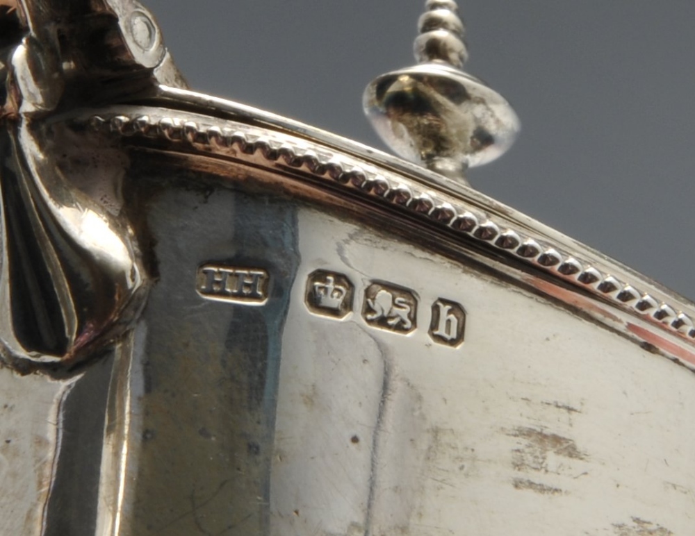 A late Victorian silver mustard pot of oval form with beaded rims and foliate capped handle, - Image 3 of 5