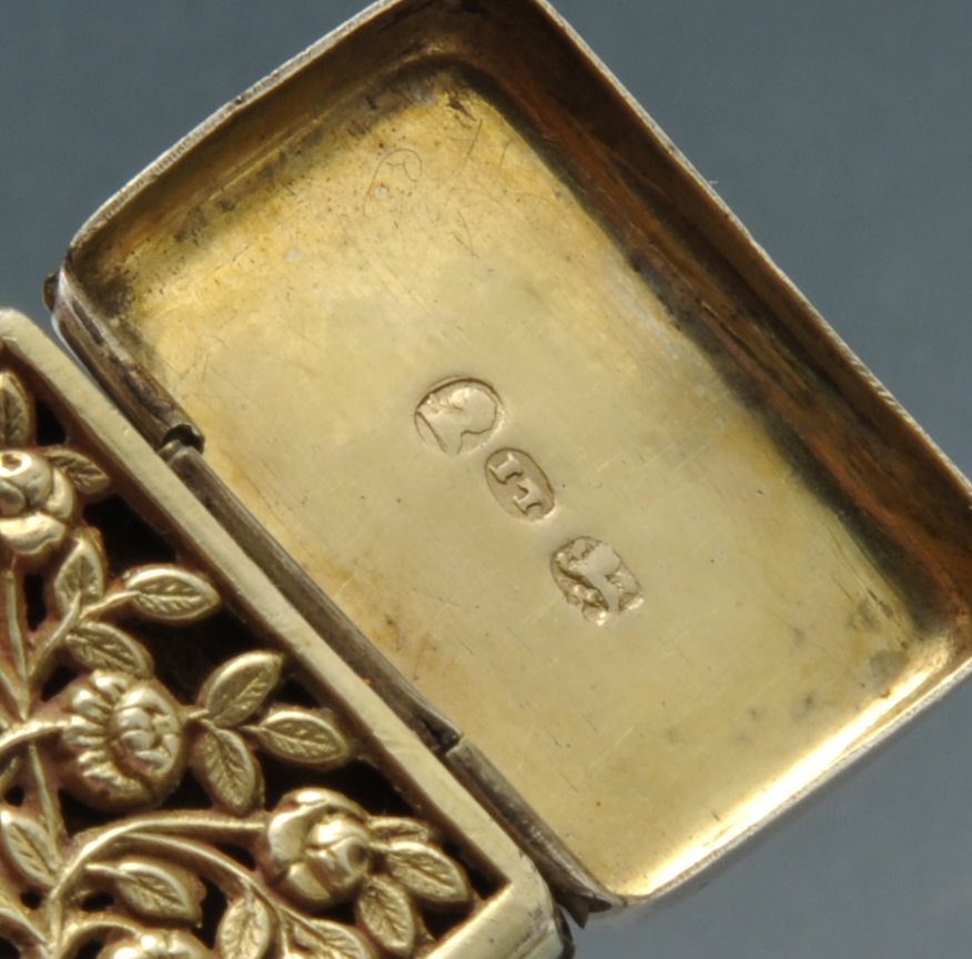 A George III silver vinaigrette, the small plain oblong form with initial engraving opening to a - Image 3 of 4