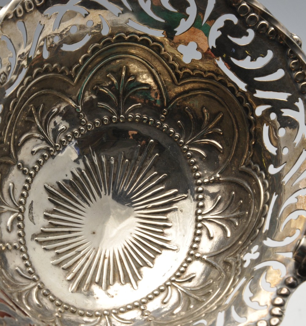 An early George III sweet-meat basket, the oval body rising to the scroll pierced border and twist - Image 4 of 4