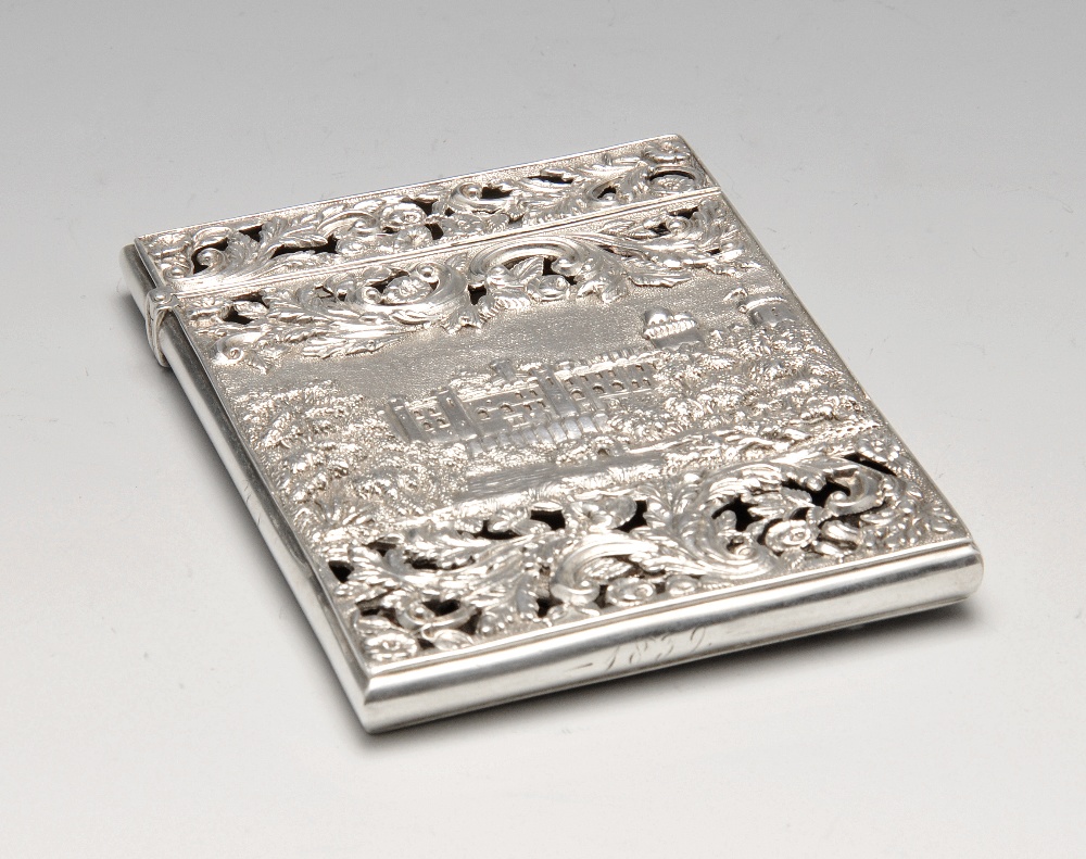 An early Victorian silver 'castle top' card case by Nathaniel Mills, decorated to the front with a